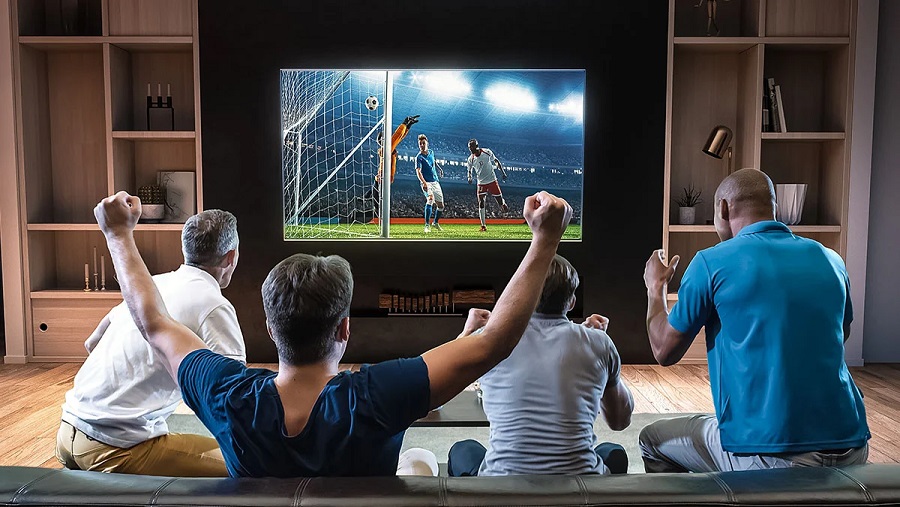 ChatGPT said: Friends enjoying a thrilling football match on TV, celebrating the game.